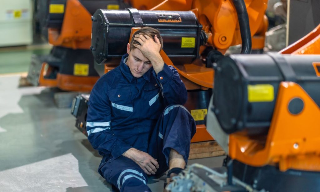 Minimizing Equipment Downtime helps prevent factory workers from being overwhelmed